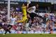 LONDON, ENGLAND - AUGUST 10: Kiko Casilla of Espanyol catches the ball under pressure from Younes Kaboul of Tottenham during a pre season friendly match between Tottenham Hotspur and Espanyol at White Hart Lane on August 10, 2013 in London, England. (Phot