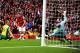 LONDON, ENGLAND - OCTOBER 19: Aaron Ramsey of Arsenal (C) shoots past goalkeeper John Ruddy of Norwich City to score their third goal during the Barclays Premier League match between Arsenal and Norwich City at Emirates Stadium on October 19, 2013 in Lon