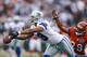 CINCINNATI, OH - DECEMBER 09: Miles Austin #19 of the Dallas Cowboys drops a pass ahead of Leon Hall #29 of the Cincinnati Bengals during the game at Paul Brown Stadium on December 9, 2012 in Cincinnati, Ohio. (Photo by Joe Robbins/Getty Images)