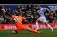 LONDON, ENGLAND - MARCH 09: Loic Remy of Queens Park Rangers scores their first goal past Simon Mignolet of Sunderland during the Barclays Premier League match between Queens Park Rangers and Sunderland at Loftus Road on March 9, 2013 in London, England.