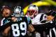 CHARLOTTE, NC - NOVEMBER 18: Officials separate Aqib Talib #31 of the New England Patriots and Steve Smith #89 of the Carolina Panthers as the scuffle after a play at Bank of America Stadium on November 18, 2013 in Charlotte, North Carolina. (Photo by G