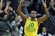 EUGENE, OR - MARCH 8: Johnathan Loyd #10 of the Oregon Ducks reacts after hitting a key three point shot during the second half of the game against the Arizona Wildcats at Matthew Knight Arena on March 8, 2014 in Eugene, Oregon. Oregon won the game 64-57