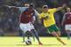 NORWICH, ENGLAND - MAY 04: Wes Hoolahan of Norwich City tangles with Christian Benteke of Aston Villa during the Barclays Premier League match between Norwich City and Aston Villa at Carrow Road on May 04, 2013 in Norwich, England. (Photo by Mark Thomps