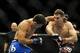 Feb 22, 2014; Las Vegas, NV, USA; Rory MacDonald (red gloves) throws a punch at Demian Maia (blue gloves) during their UFC welterweight bout at Mandalay Bay. MacDonald won by way of a 29-28 decision. Mandatory Credit: Stephen R. Sylvanie-USA TODAY Sports