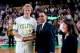 BOSTON, MA - 1984: Larry Bird #33 of the Boston Celtics is awarded the trophy for Most Valuable Player of the Boston Celtics, an honor voted on by the New England press, before a game circa 1984 at the Boston Garden in Boston, Massachusetts. NOTE TO USER: