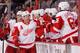 OTTAWA, ON - FEBRUARY 27: Daniel Alfredsson #11 of the Detroit Red Wings celebrates a first period goal against the Ottawa Senators with team mates Tomas Jurco #26 and Danny DeKeyser #65 during an NHL game at Canadian Tire Centre on February 27, 2014 in O