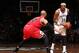 Nets forward Paul Pierce squares off against Bulls forward Taj Gibson.