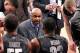 NEW YORK, NY - FEBRUARY 01: Head coach John Thompson III of the Georgetown Hoyas talks with teamates Jabril Trawick #55 and Moses Ayegba #32 during a timeout in the game against the Michigan State Spartans during the game at Madison Square Garden on Febr