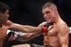 Oct 19, 2013; Houston, TX, USA; Gilbert Melendez (red gloves) fights against Diego Sanchez (blue gloves) in their lightweight bout during UFC 166 at Toyota Center. Mandatory Credit: Andrew Richardson-USA TODAY Sports