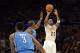 Mar 9, 2014; Los Angeles, CA, USA; Los Angeles Lakers shooting guard Jodie Meeks (20) shoots over Oklahoma City Thunder power forward Serge Ibaka (9) and small forward Perry Jones (3) during the second half at Staples Center. Mandatory Credit: Richard Mac