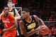 CHAMPAIGN, IL - FEBRUARY 1: Roy Devyn Marble #4 of the Iowa Hawkeyes looks to the basket against the Illinois Fighting Illini during the game at State Farm Center on February 1, 2014 in Champaign, Illinois. Iowa won the game 81-74. (Photo by Joe Robbins/