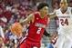 Nov 15, 2013; Fayetteville, Ar, USA; Louisiana-Lafayette Ragin' Cajuns guard Elfrid Payton (2) dribbles past Arkansas Razorbacks guard Michael Qualls (24) during a game at Bud Walton Arena Arena. Arkansas defeated Louisiana-Lafayette 76-63. Mandatory Cr