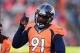 Dec 8, 2013; Denver, CO, USA; Denver Broncos defensive end Robert Ayers (91) reacts to a tackle in the second quarter against the Tennessee Titans at Sports Authority Field at Mile High. The Broncos defeated the Titans 51-28. Mandatory Credit: Ron Chenoy-