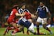 CARDIFF, WALES - FEBRUARY 21: George North of Wales is tackled by Yoann Huget and Wesley Fofana (12) during the RBS Six Nations match between Wales and France at the Millennium Stadium on February 21, 2014 in Cardiff, Wales. (Photo by David Rogers/Getty
