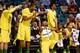 LAS VEGAS, NV - MARCH 12: Oregon Ducks players including Johnathan Loyd #10 (on ground) react late in their first-round game of the Pac-12 Basketball Tournament against the Oregon State Beavers at the MGM Grand Garden Arena on March 12, 2014 in Las Vegas