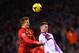 LIVERPOOL, ENGLAND - JANUARY 18: Lucas of Liverpool wins a header with Andreas Weimann of Aston Villa during the Barclays Premier League match between Liverpool and Aston Villa at Anfield on January 18, 2014 in Liverpool, England. (Photo by Michael Regan