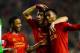 LIVERPOOL, ENGLAND - JANUARY 28: Daniel Sturridge (R) of Liverpool is congratulated by teammates Luis Suarez (C) and Raheem Sterling (L) after scoring his team's third goal as dejected Everton goalkeeper Tim Howard looks on during the Barclays Premier Le