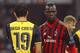 MILAN, ITALY - FEBRUARY 19: Mario Balotelli (R) of AC Milan and Diego Costa of Club Atletico de Madrid look on during the UEFA Champions League Round of 16 match between AC Milan and Club Atletico de Madrid at Stadio Giuseppe Meazza on February 19, 2014
