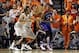 Mar 1, 2014; Stillwater, OK, USA; Kansas Jayhawks center Joel Embiid (21) is defended by Oklahoma State Cowboys forward/center Kamari Murphy (21) and guard Markel Brown (22) during the first half at Gallagher-Iba Arena. Mandatory Credit: Tim Heitman-USA