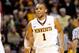 Minnesota guard Andre Hollins runs onto the court during the first half of an NCAA college basketball game against Purdue in Minneapolis, Sunday, Jan. 5, 2014. (AP Photo/Ann Heisenfelt)