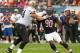 CHICAGO, IL - OCTOBER 06: Julius Peppers #90 of the Chicago Bears rushes against Zach Strief #64 of the New Orleans Saints at Soldier Field on October 6, 2013 in Chicago, Illinois. The Saints defeated the Bears 26-18. (Photo by Jonathan Daniel/Getty Ima