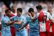 MANCHESTER, ENGLAND - MAY 13: Carlos Tevez of Manchester City clashes with Joey Barton of QPR after being fouled during the Barclays Premier League match between Manchester City and Queens Park Rangers at the Etihad Stadium on May 13, 2012 in Manchester,