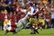 LANDOVER, MD - DECEMBER 01: Defensive end Justin Tuck #91 and defensive tackle Johnathan Hankins #96 of the New York Giants sack quarterback Robert Griffin III #10 of the Washington Redskins during the fourth quarter of the Giants 24-17 win at FedExField