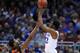 Mar 13, 2014; Kansas City, MO, USA; Kansas Jayhawks guard Andrew Wiggins (22) shoots a three point shot as Oklahoma State Cowboys guard Marcus Smart (33) defends during the first half in the second round of the Big 12 Conference college basketball tournam
