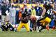 PITTSBURGH, PA - DECEMBER 23: Ryan Clark #25 of the Pittsburgh Steelers recovers a fumble by A.J. Green #18 of the Cincinnati Bengals during the game at Heinz Field on December 23, 2012 in Pittsburgh, Pennsylvania. (Photo by Jared Wickerham/Getty Images)