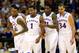 KANSAS CITY, MO - MARCH 13: Andrew Wiggins #22, Naadir Tharpe #10, Wayne Selden, Jr. #1, Jamari Traylor #31, and Perry Ellis #34 of the Kansas Jayhawks walk toward the bench during a timeout in the Big 12 Basketball Tournament quarterfinal game against t