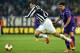 TURIN, ITALY - MARCH 13: Giorgio Chiellini (L) of Juventus is tackled by David Pizarro of ACF Fiorentina during the UEFA Europa League Round of 16 match between Juventus and ACF Fiorentina at Juventus Arena on March 13, 2014 in Turin, Italy. (Photo by V