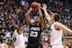 SALT LAKE CITY, UT - MARCH 23: Wesley Saunders #23 of the Harvard Crimson goes up for a shot between Solomon Hill #44 and Kaleb Tarczewski #35 of the Arizona Wildcats in the first half during the third round of the 2013 NCAA Men's Basketball Tournament a