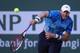 INDIAN WELLS, CA - MARCH 12: John Isner serves to Fernando Verdasco of Spain during the BNP Paribas Open at Indian Wells Tennis Garden on March 12, 2014 in Indian Wells, California. (Photo by Jeff Gross/Getty Images)
