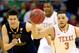 KANSAS CITY, MO - MARCH 13: Javan Felix #3 of the Texas Longhorns controls the ball as Nathan Adrian #11 of the West Virginia Mountaineers chases during the Big 12 Basketball Tournament quarterfinal game at Sprint Center on March 13, 2014 in Kansas City,