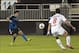 Mar 11, 2014; Santa Clara, Californial, USA; San Jose Earthquakes midfielder Shea Salinas (6) passes the ball up field past Toluca FC midfielder Diego de la Torre (8) during the second half at Buck Shaw Stadium. The San Jose Earthquakes and Toluca FC tied