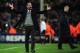 BARCELONA, SPAIN - MARCH 08: Josep Guardiola the Barcelona coach celebrates as Arsene Wenger the Arsenal coach looks on during the UEFA Champions League round of 16 second leg match between Barcelona and Arsenal at the Nou Camp Stadium on March 8, 2011 i
