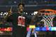 ATLANTA, GA - APRIL 08: Russ Smith #2 of the Louisville Cardinals celebrates as he cuts down the net after they won 82-76 against the Michigan Wolverines during the 2013 NCAA Men's Final Four Championship at the Georgia Dome on April 8, 2013 in Atlanta,