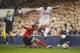 LONDON, ENGLAND - MARCH 13: Kyle Naughton of Tottenham Hotspur is tackled by Lazar Markovic of Benfica during the UEFA Europa League Round of 16 first leg match between Tottenham Hotspur FC and SL Benfica at White Hart Lane on March 13, 2014 in London, E