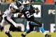 PHILADELPHIA, PA - AUGUST 15: Kenjon Barner #25 of the Carolina Panthers carries the ball as Earl Wolff #28 of the Philadelphia Eagles defends on August 15, 2013 at Lincoln Financial Field in Philadelphia, Pennslyvania. (Photo by Elsa/Getty Images)