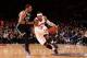 NEW YORK, NY - JANUARY 20: Carmelo Anthony #7 of the New York Knicks dribbles against Paul Pierce #34 of the Brooklyn Nets during a game at Madison Square Garden in New York City on January 20, 2014. NOTE TO USER: User expressly acknowledges and agrees t