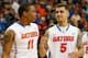 ATLANTA, GA - MARCH 14: Scottie Wilbekin #5 of the Florida Gators reacts with Lexx Edwards #11 after their 72-49 win over the Missouri Tigers during the quarterfinals of the SEC Men's Basketball Tournament at Georgia Dome on March 14, 2014 in Atlanta, Ge