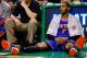 BOSTON, MA - MARCH 12: Carmelo Anthony #7 of the New York Knicks sits on the floor near the bench near the end of the game against the Boston Celtics during the game at TD Garden on March 12, 2014 in Boston, Massachusetts. NOTE TO USER: User expressly ack