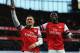 LONDON, ENGLAND - FEBRUARY 16: Lukas Podolski (L) of Arsenal celebrates with team mate Yaya Sanogo after scoring during the FA Cup Fifth Round match between Arsenal and Liverpool at the Emirates Stadium on February 16, 2014 in London, England. (Photo by