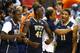 GREENSBORO, NC - MARCH 14: Talib Zanna #42 of the Pittsburgh Panthers celebrates on the bench with teammates against the North Carolina Tar Heels during the quarterfinals of the 2014 Men's ACC Basketball Tournament at Greensboro Coliseum on March 14, 201