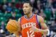 Feb 12, 2014; Salt Lake City, UT, USA; Philadelphia 76ers small forward Evan Turner (12) dribbles up the court during the first quarter against the Utah Jazz at EnergySolutions Arena. Mandatory Credit: Russ Isabella-USA TODAY Sports