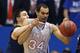 LAWRENCE, KS - FEBRUARY 8: Perry Ellis #34 of the Kansas Jayhawks tries to grab a rebound but is fouled by Nathan Adrian #11 of the West Virginia Mountaineers in the second half at Allen Fieldhouse on February 8, 2014 in Lawrence, Kansas. (Photo by Ed Zu