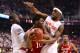 Mar 14, 2014; Greensboro, NC, USA; Syracuse Orange guard Trevor Cooney (10) looks to pass as Syracuse Orange center Baye-Moussa Keita (12) and forward C.J. Fair (5) defend in the first half in the quarterfinals of the ACC college basketball tournament at