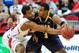 RALEIGH, NC - DECEMBER 31: T.J. Warren #24 of the North Carolina State Wolfpack defends against Derrell Armstrong #3 of the UNC Greensboro Spartans during play at PNC Arena on December 31, 2012 in Raleigh, North Carolina. North Carolina State won 89-68.