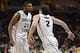 March 10, 2014; Las Vegas, NV, USA; Brigham Young Cougars guard Anson Winder (20) and guard Matt Carlino (2) celebrate against the San Francisco Dons during the second half in the semifinals of the West Coast Conference tournament at Orleans Arena. Mandat