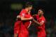 MANCHESTER, ENGLAND - DECEMBER 26: Luis Suarez (C) and Raheem Sterling (R) of Liverpool congratulate goalscorer Philippe Coutinho during the Barclays Premier League match between Manchester City and Liverpool at Etihad Stadium on December 26, 2013 in Man